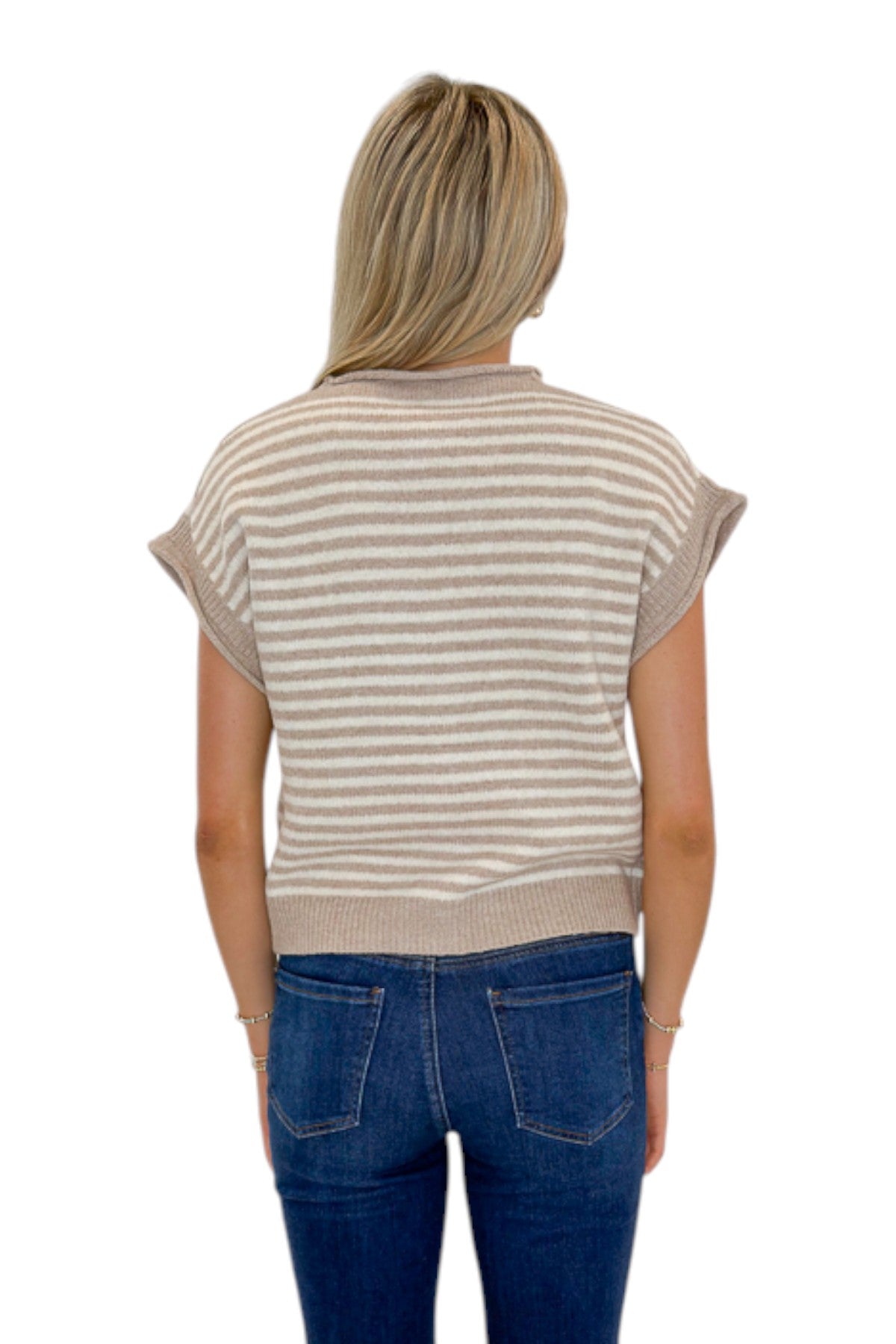 Back view of woman wearing Swagger Boutique’s Taupe & Cream Striped Sleeveless Sweater by Entro with jeans against white studio background.
