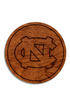 Wooden coaster with engraved UNC logo on a white background