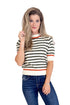 Woman wearing a striped shirt and jeans on a white background