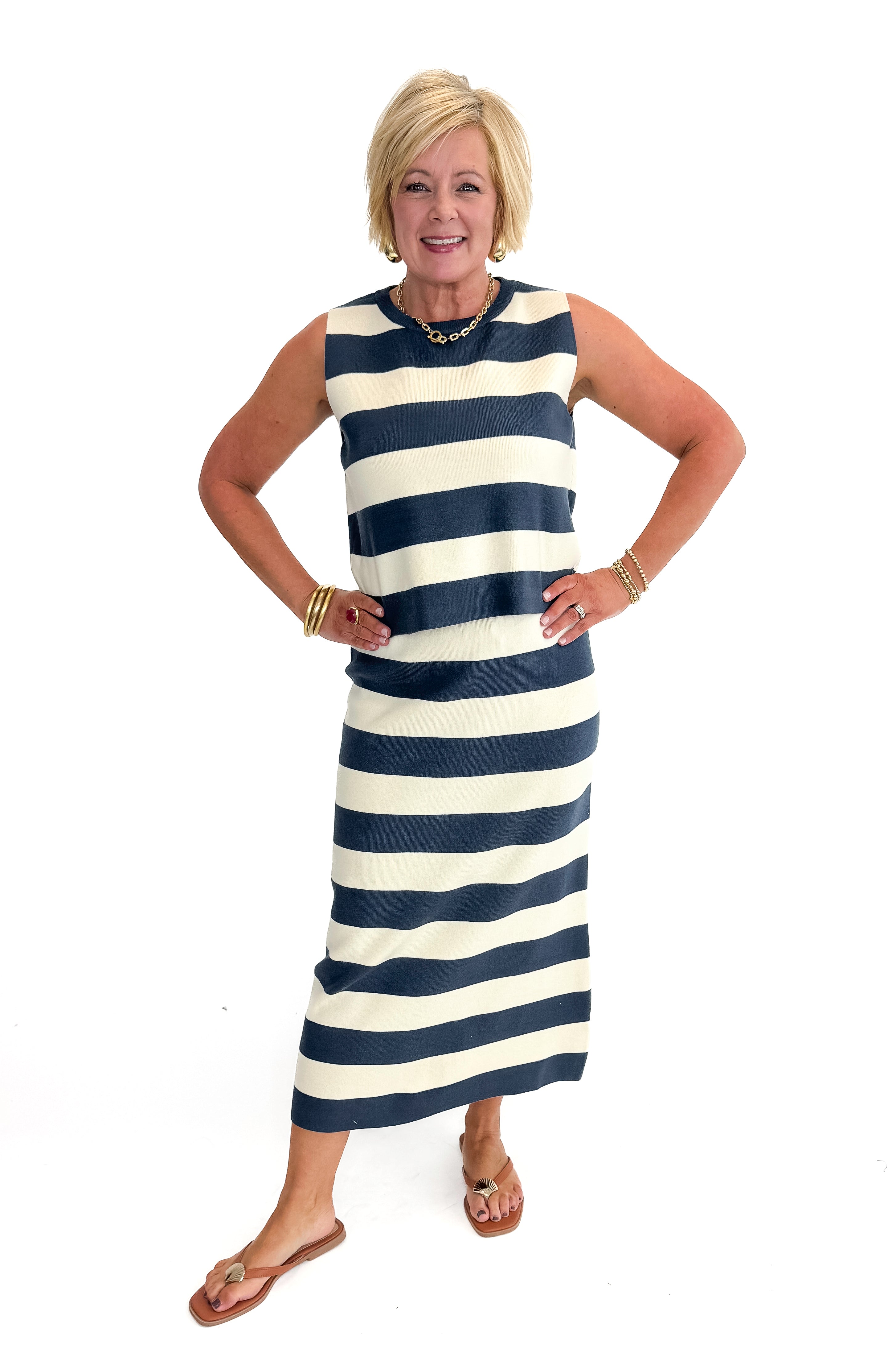 Front view of woman wearing Navy & Cream Striped Midi Skirt with matching tank against white studio background.