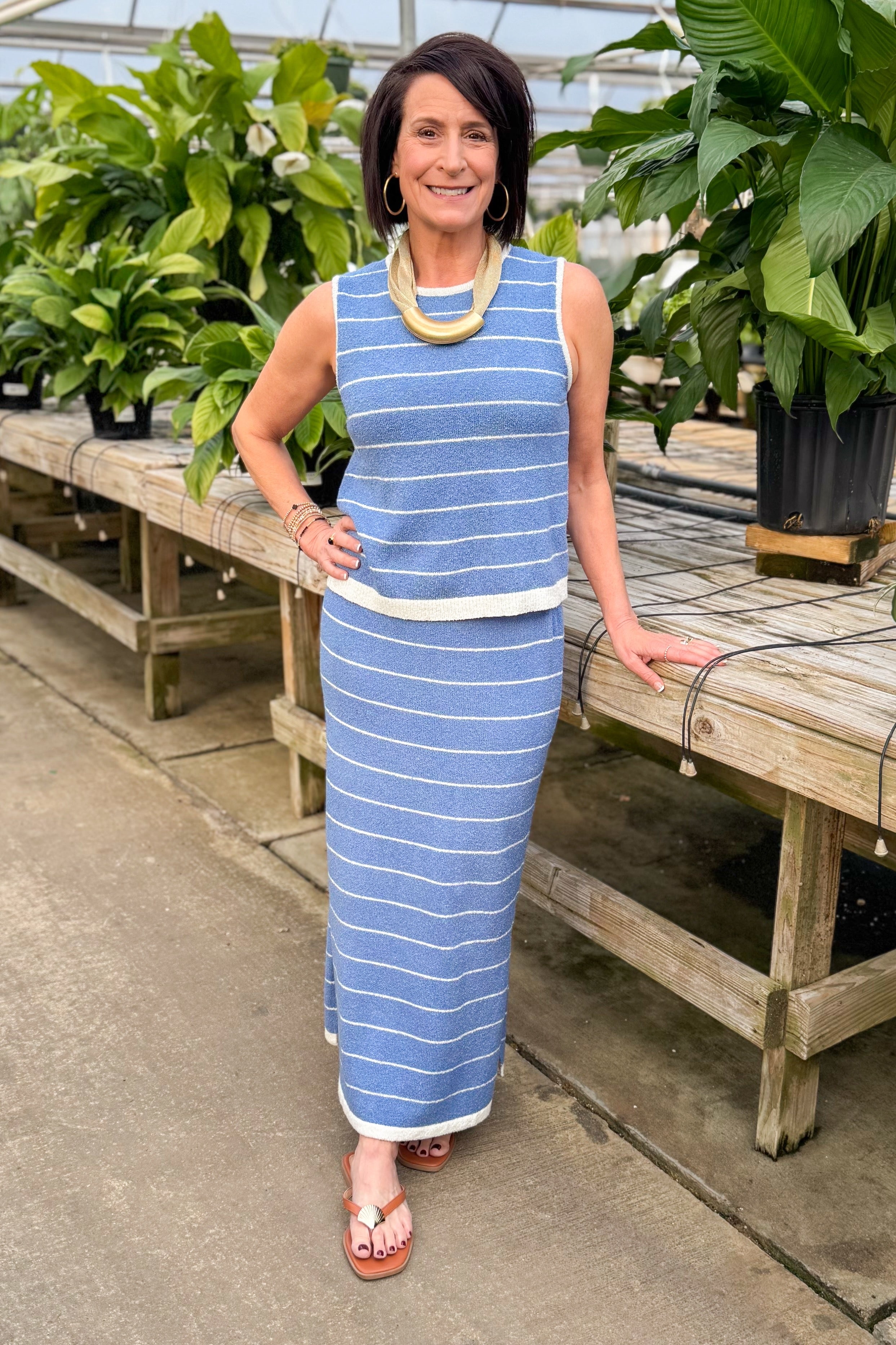 Front view of woman wearing Blue & Cream Striped Knit Tank with matching skirt against white studio background.