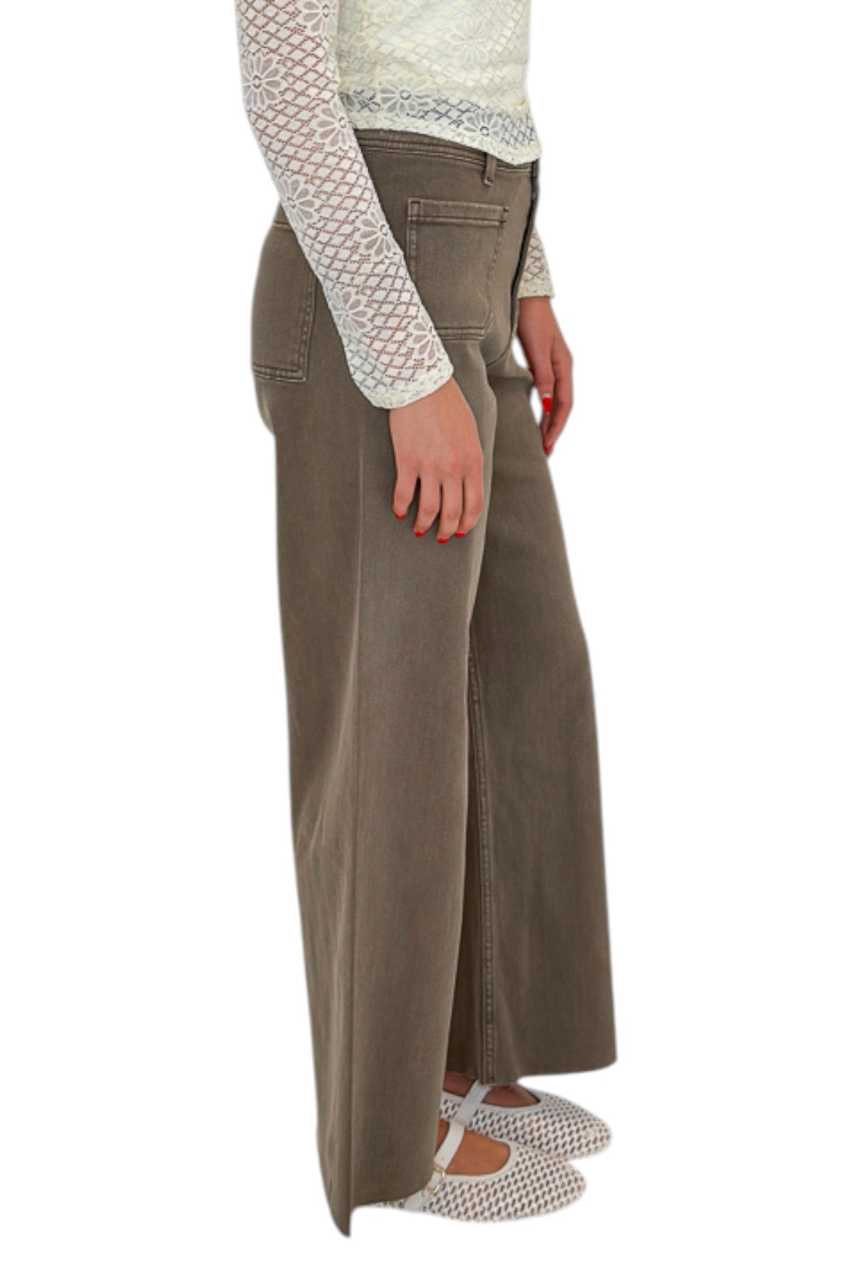 Side view of woman wearing Swagger Boutique’s Washed Brown Patch Pocket Wide Leg Jeans with top against white studio background.