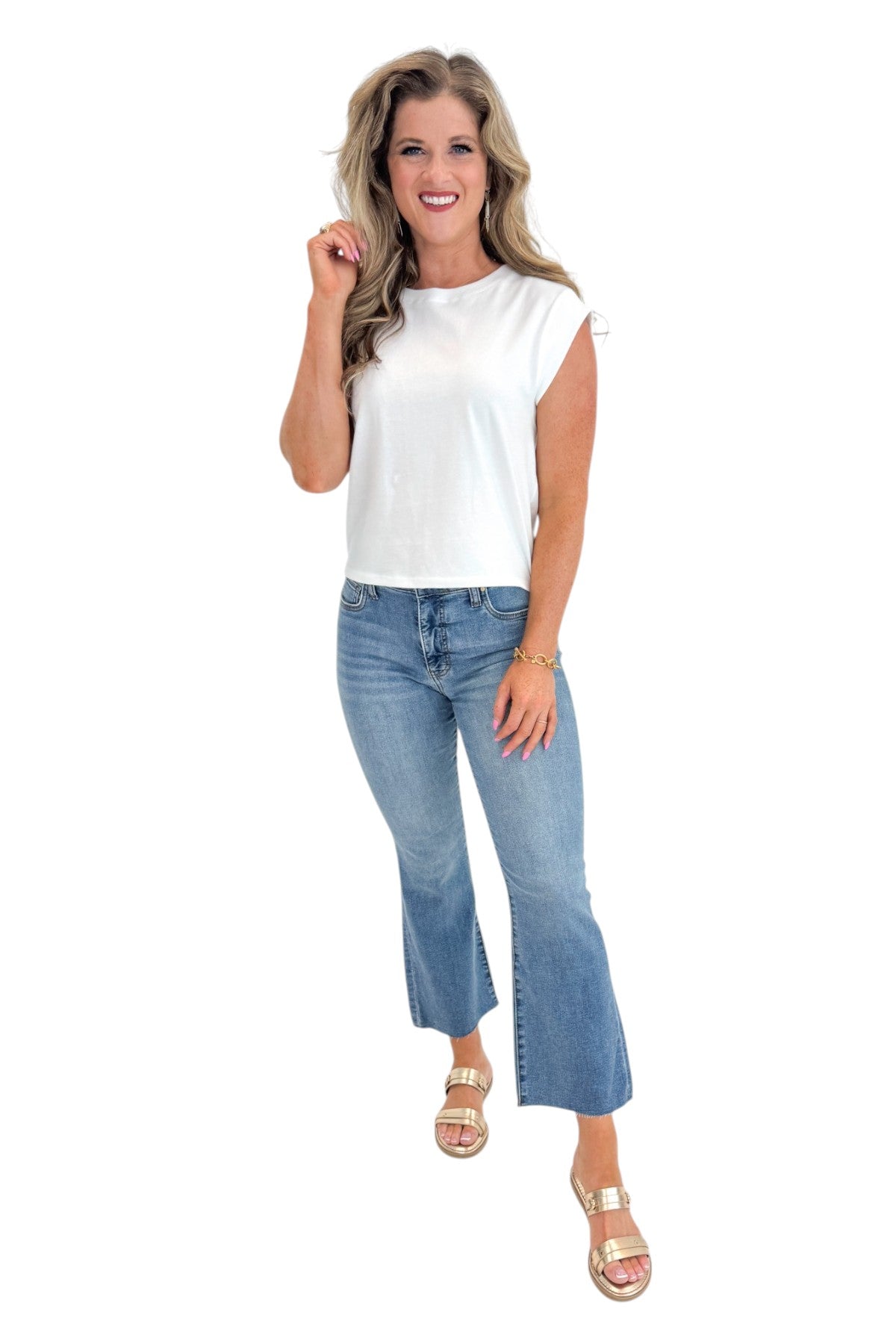 Front view of woman wearing Swagger Boutique’s White Camino Jersey Top by Z Supply with jeans against white studio background.