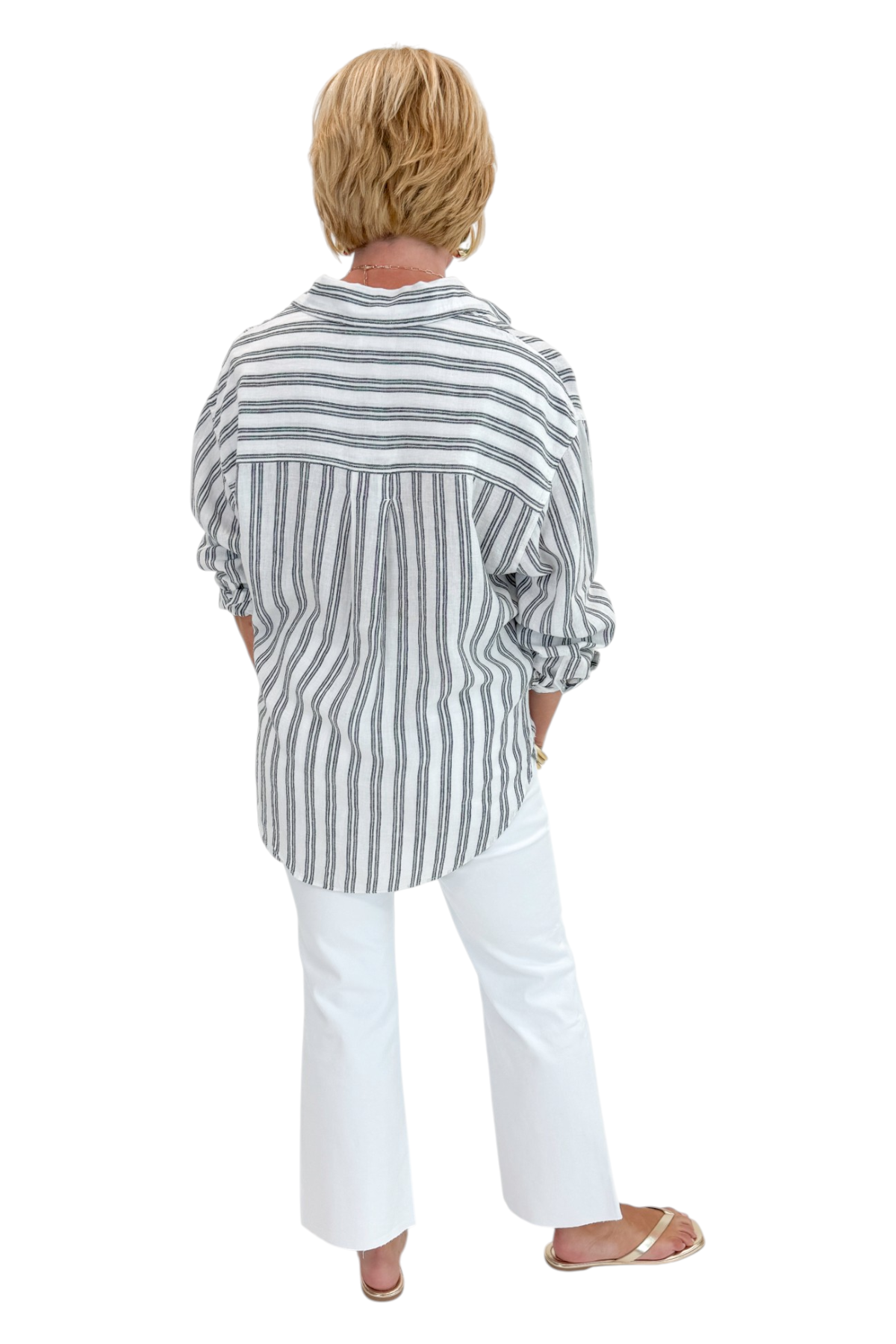 Back view of woman wearing Swagger Boutique’s White The Perfect Striped Button Up Top by Z Supply with jeans against white studio background.