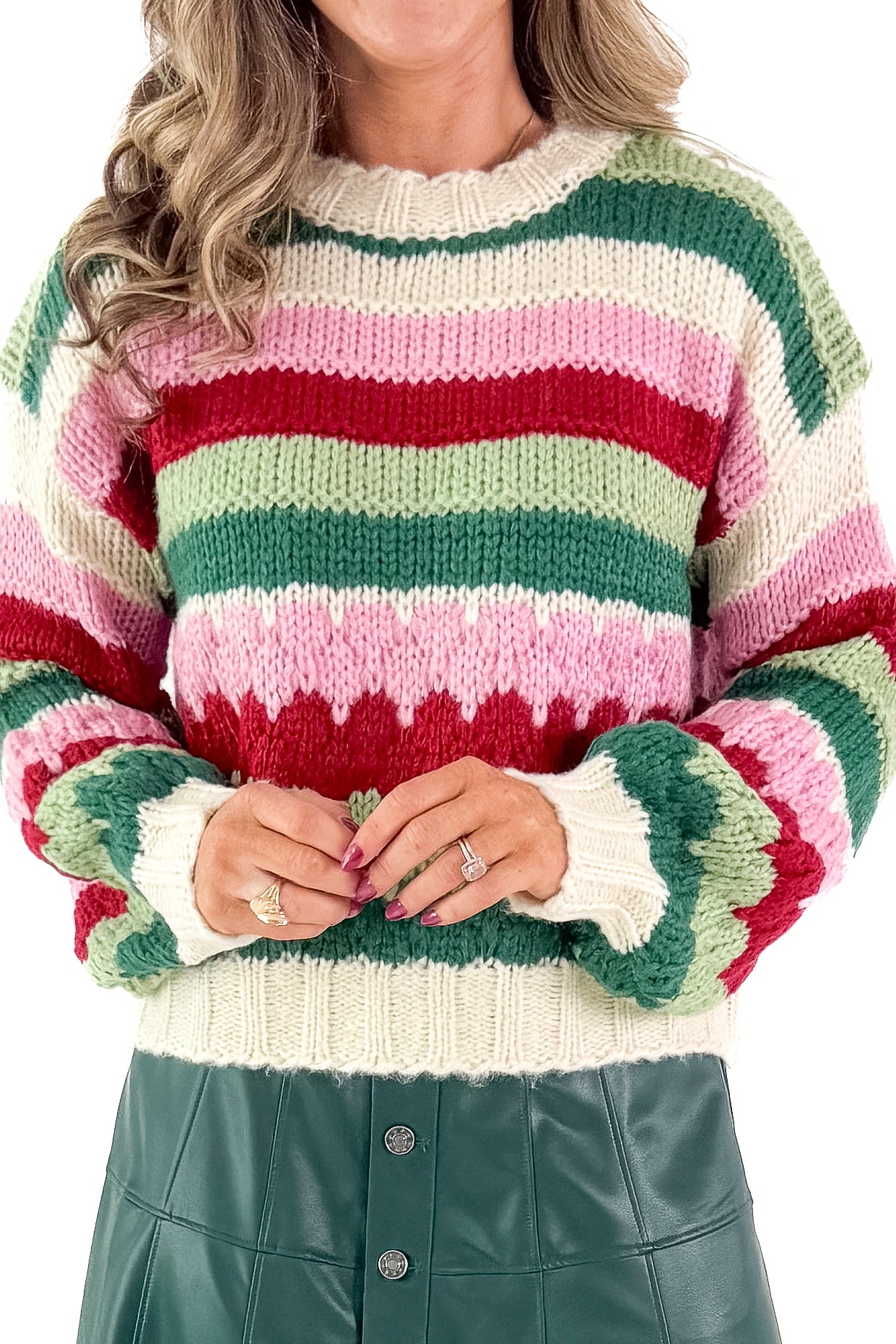 Front detailed view of woman wearing Hunter Green & Multi Striped Knit Sweater with green skirt against white studio background.