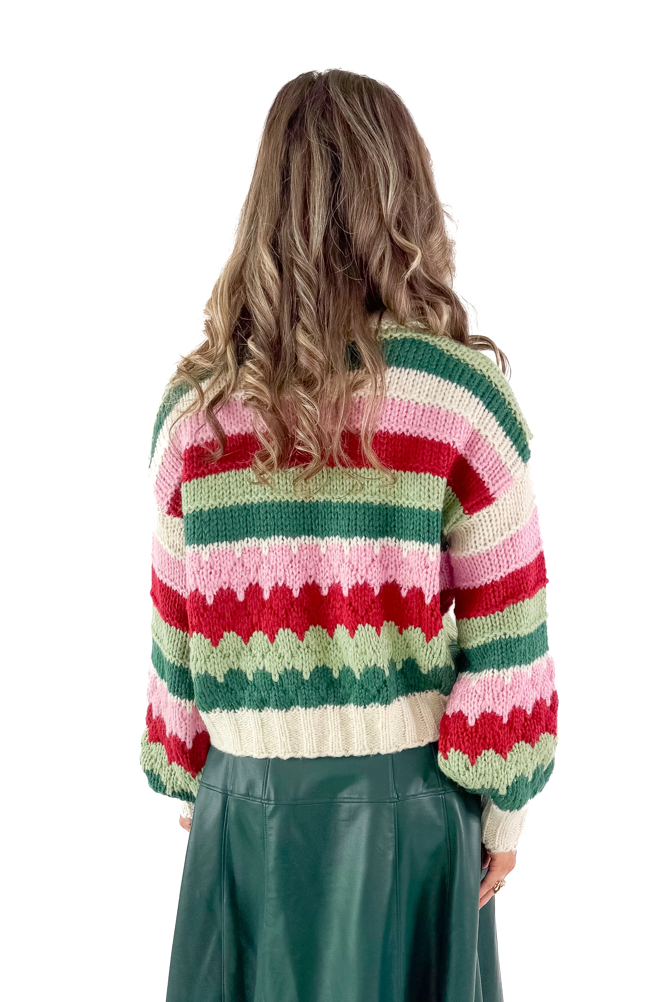 Back view of woman wearing Hunter Green & Multi Striped Knit Sweater with green skirt against white studio background.