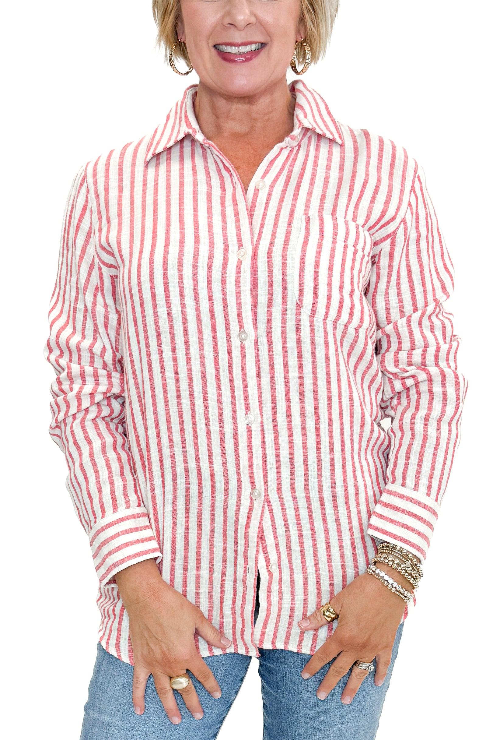 Front detail view of woman wearing Crimson Crush Saturdays Stripe Shirt by Z Supply with jeans against white studio background.