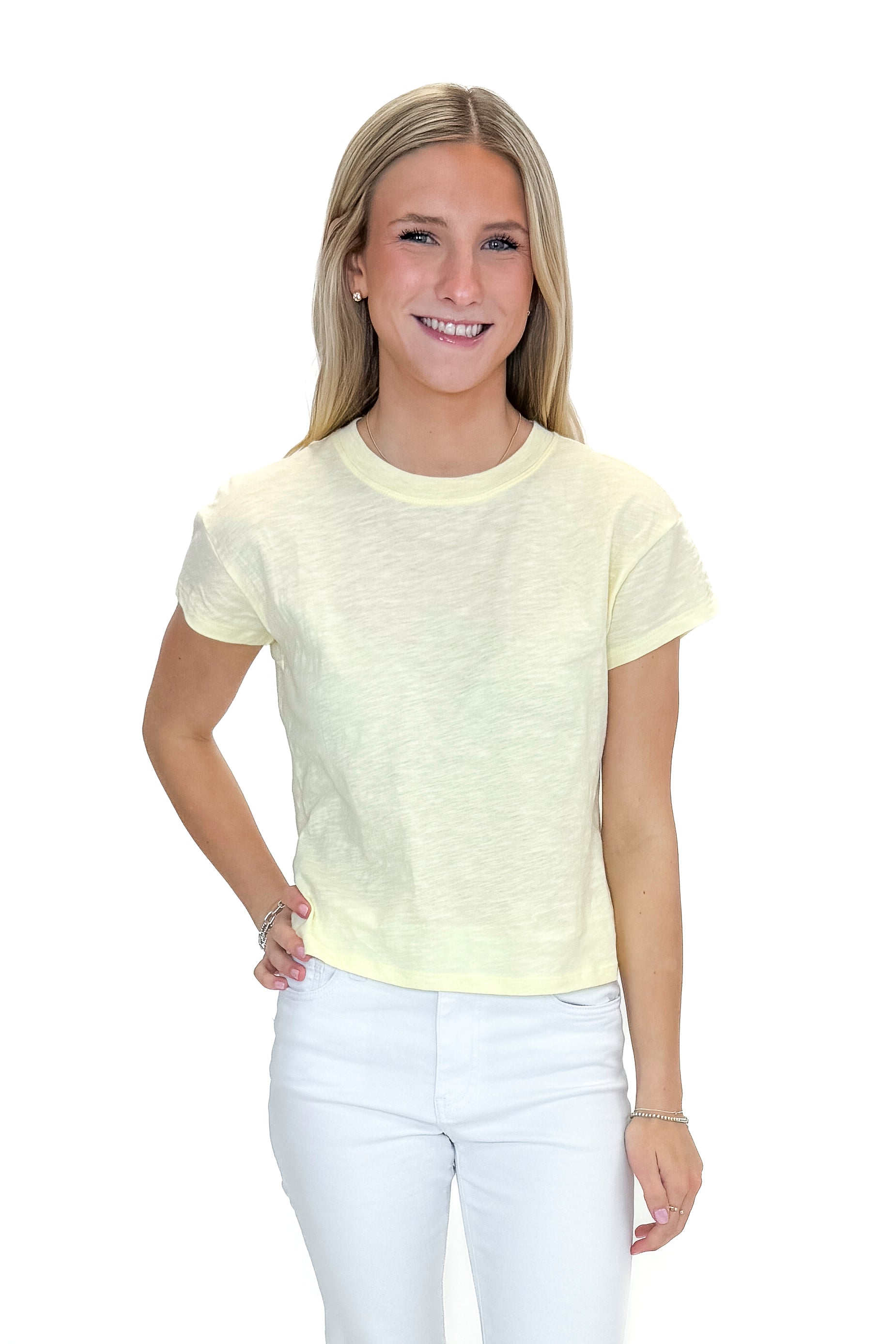 Front view of woman wearing Pineapple Modern Slub Tee by Z Supply with jeans against white studio background.