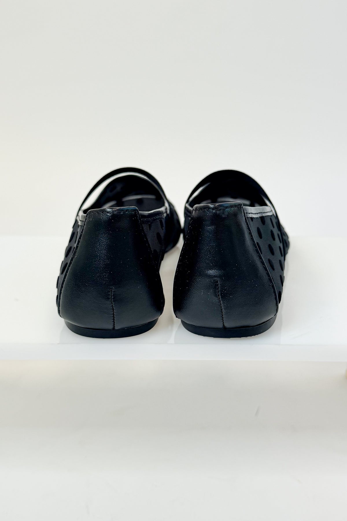 Zenda- Black Polka Dot Mesh Flat against studio background back view
