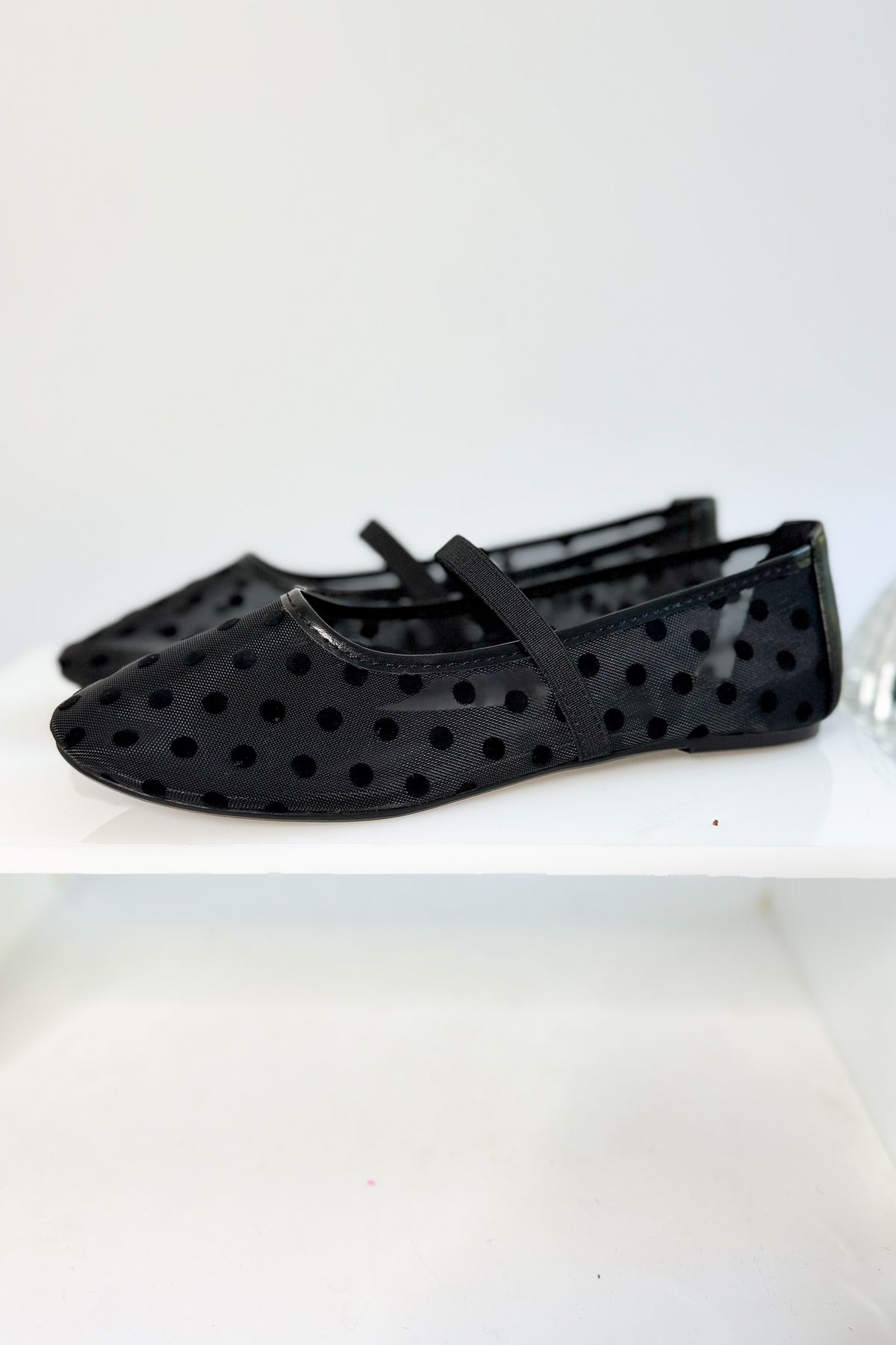 Zenda- Black Polka Dot Mesh Flat against studio background side view