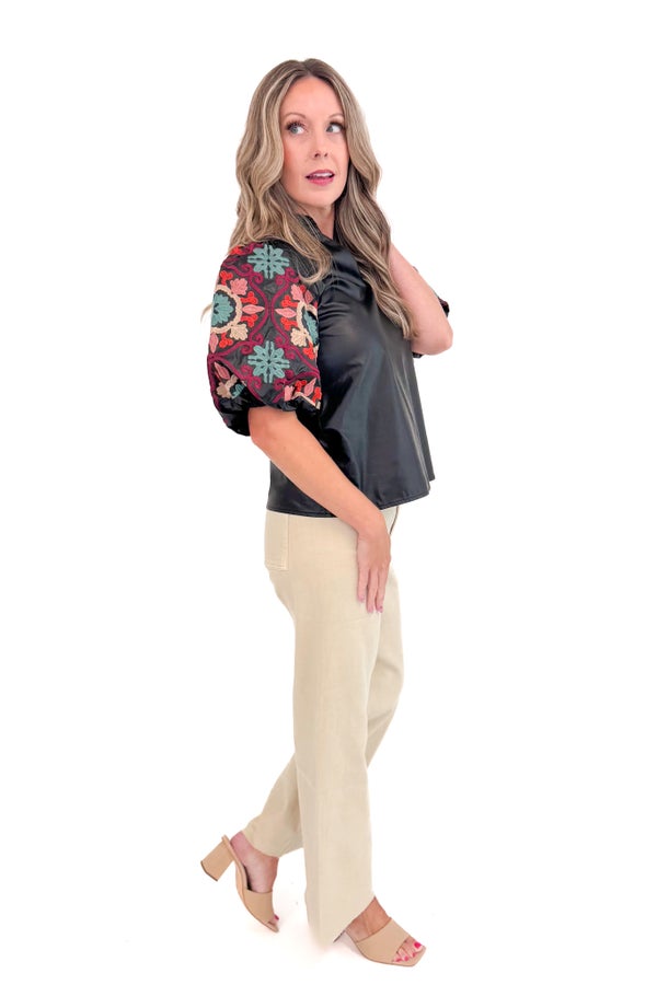 New Dawn black faux leather top with embroidered sleeves - side full view on model