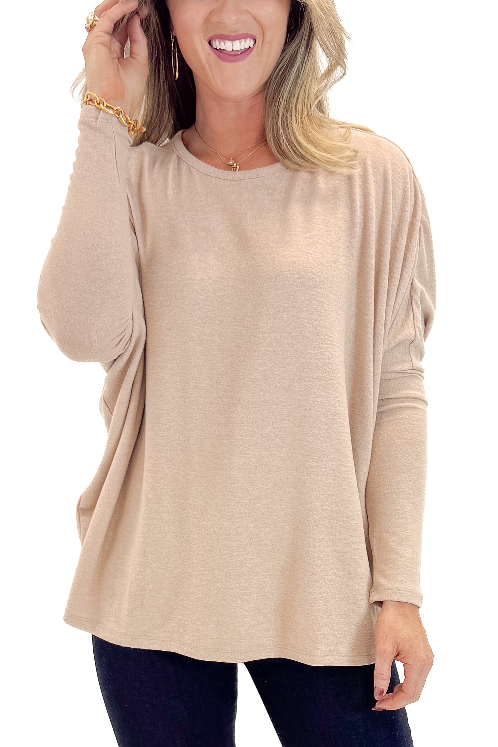 Front detail view of woman wearing Taupe Dolman Sleeve Top with jeans against white studio background.