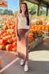 Woman wearing brown Demure Maxi Skirt by Z Supply - front view showing flowy silhouette and elastic waistband