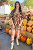 Woman wearing Golden Opportunity Brown & Multi Mixed Print 3/4 Sleeve Dress - front view showing vibrant mixed print pattern and 3/4 sleeves