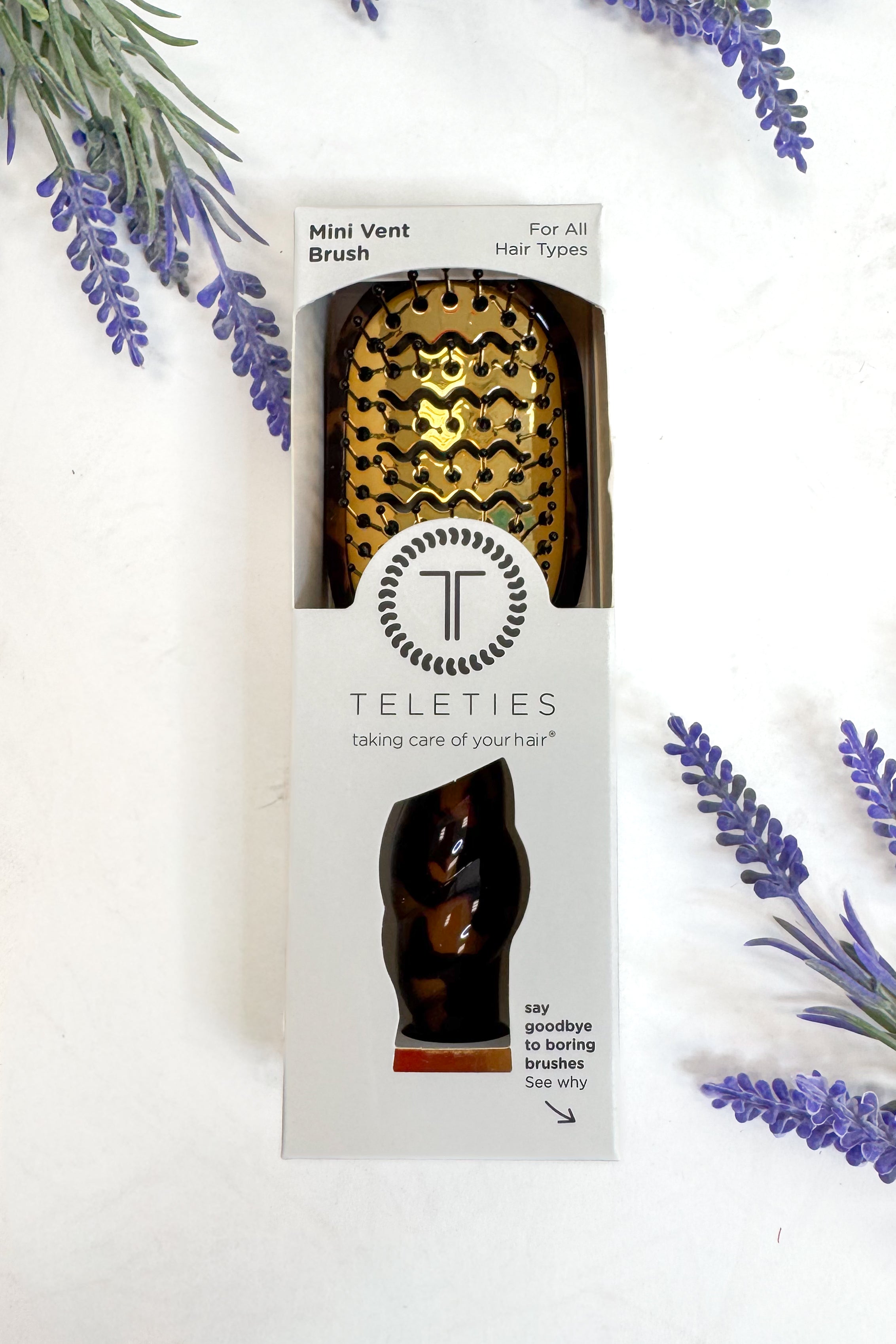 Teleties mini vent brush packaging with decorative lavender on a white background