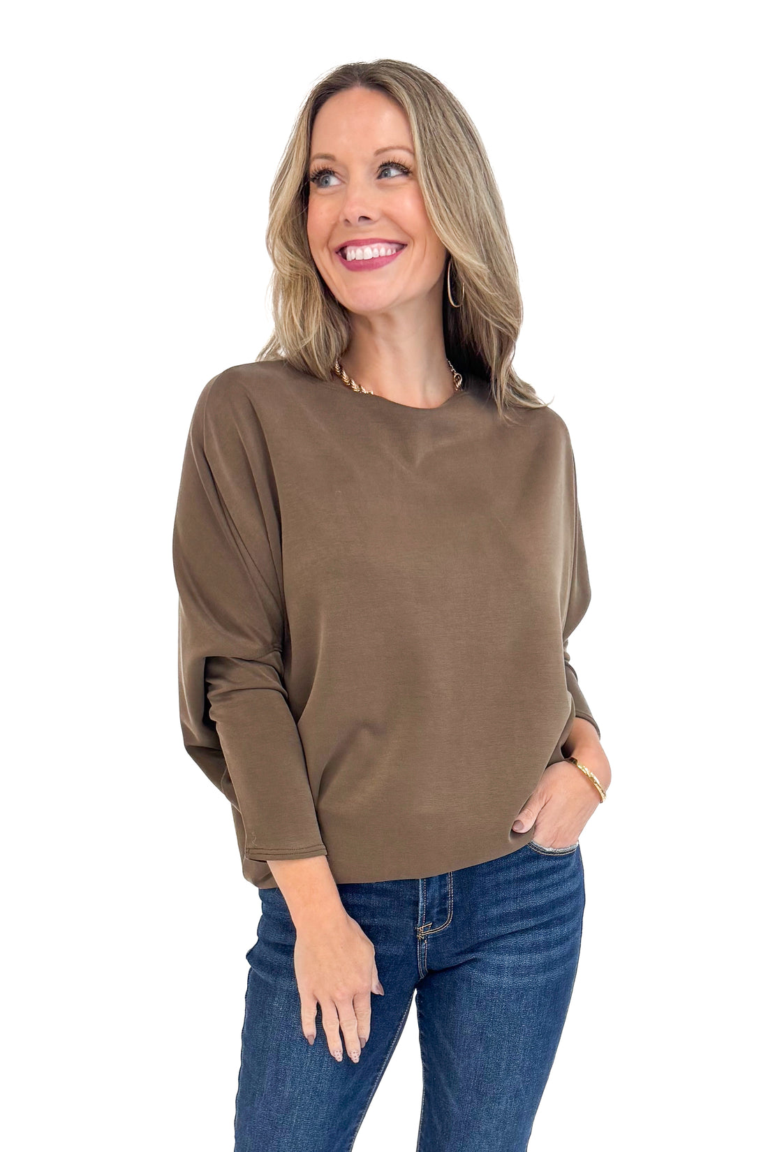Woman wearing For Keeps Brown Boatneck Dolman Sleeve Top - front view showing elegant boatneck and relaxed dolman sleeves.