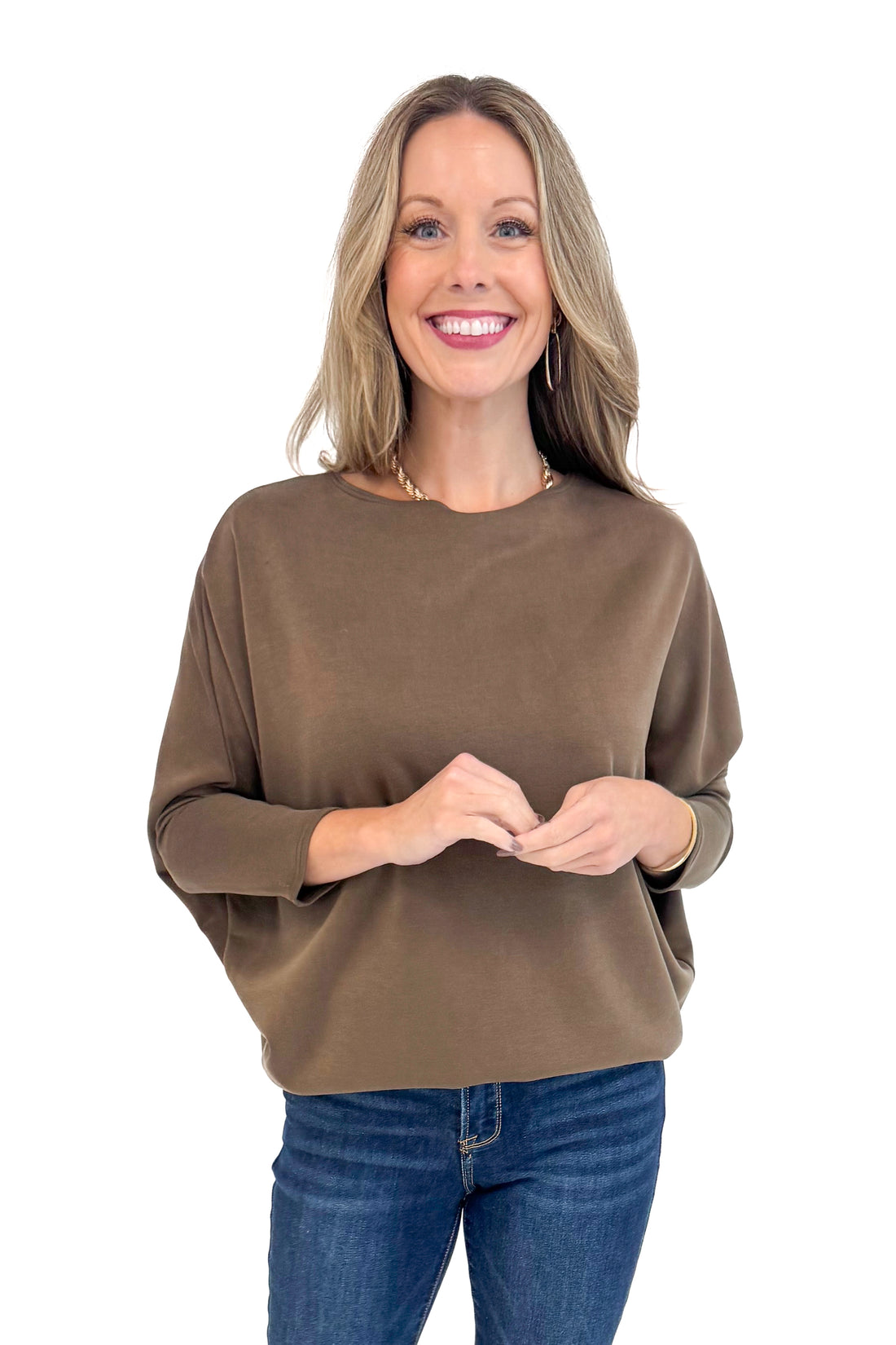 Woman wearing For Keeps Brown Boatneck Dolman Sleeve Top - front view showing elegant boatneck and relaxed dolman sleeves.
