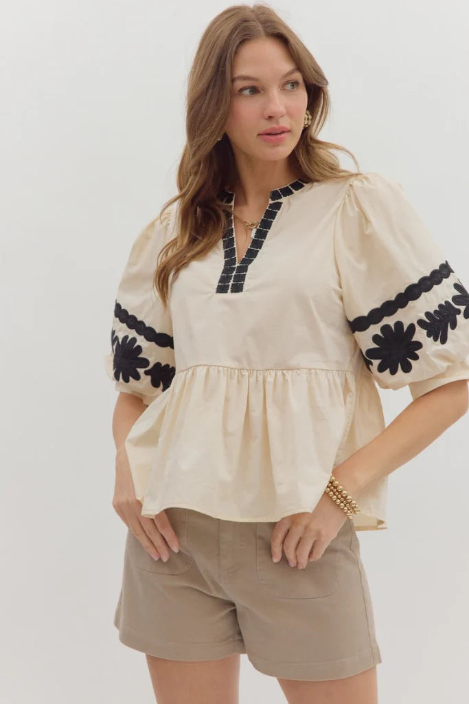 In Good Spirits Ecru With Black Embroidered Sleeve Peplum Top by Entro