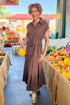 Woman wearing By The Firelight Chocolate Button Up Midi Dress by Entro - front view showing button-up design and midi length