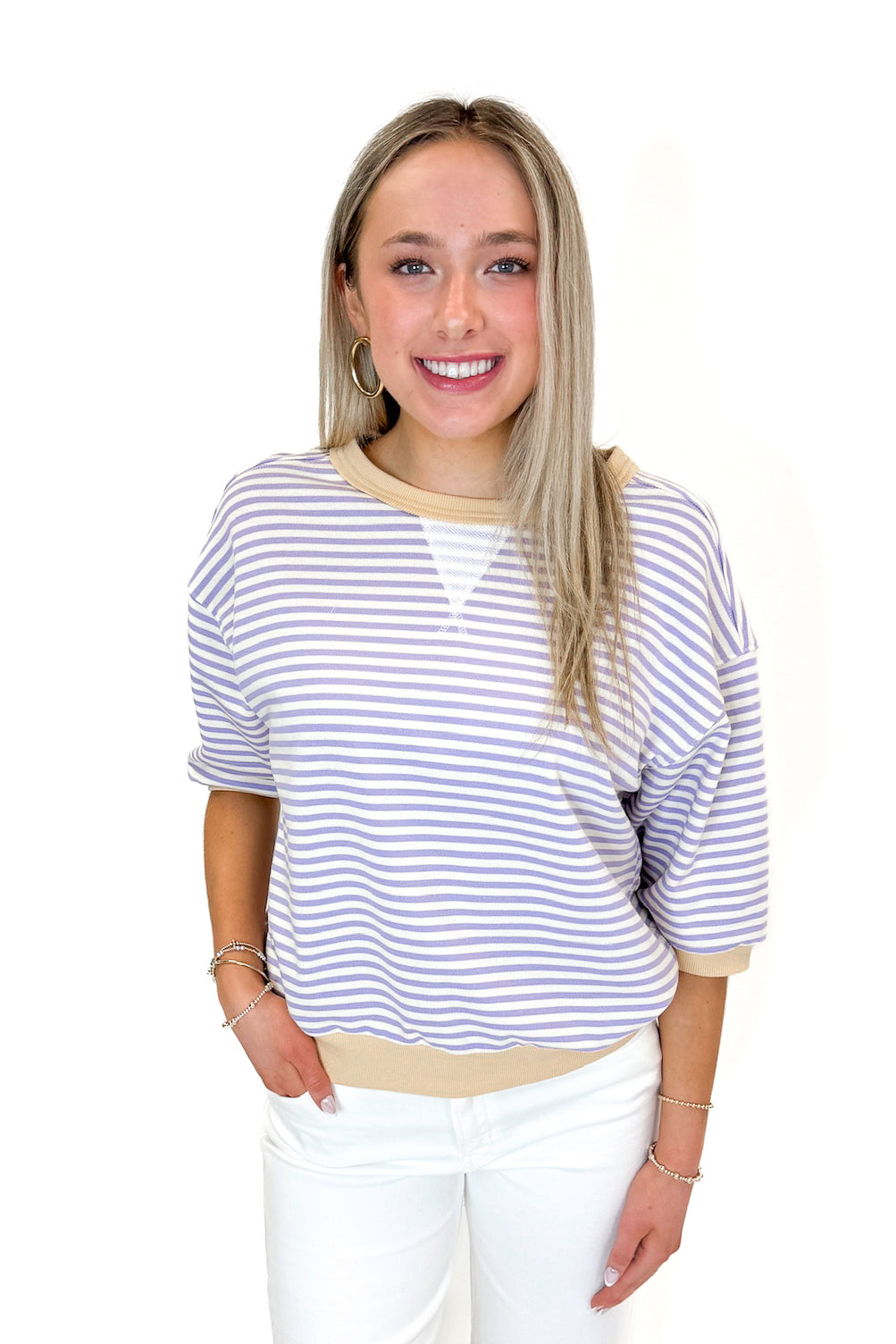 Front view of woman wearing Lavender &amp; Yellow Striped Half Sleeve Sweatshirt with jeans against white studio background.