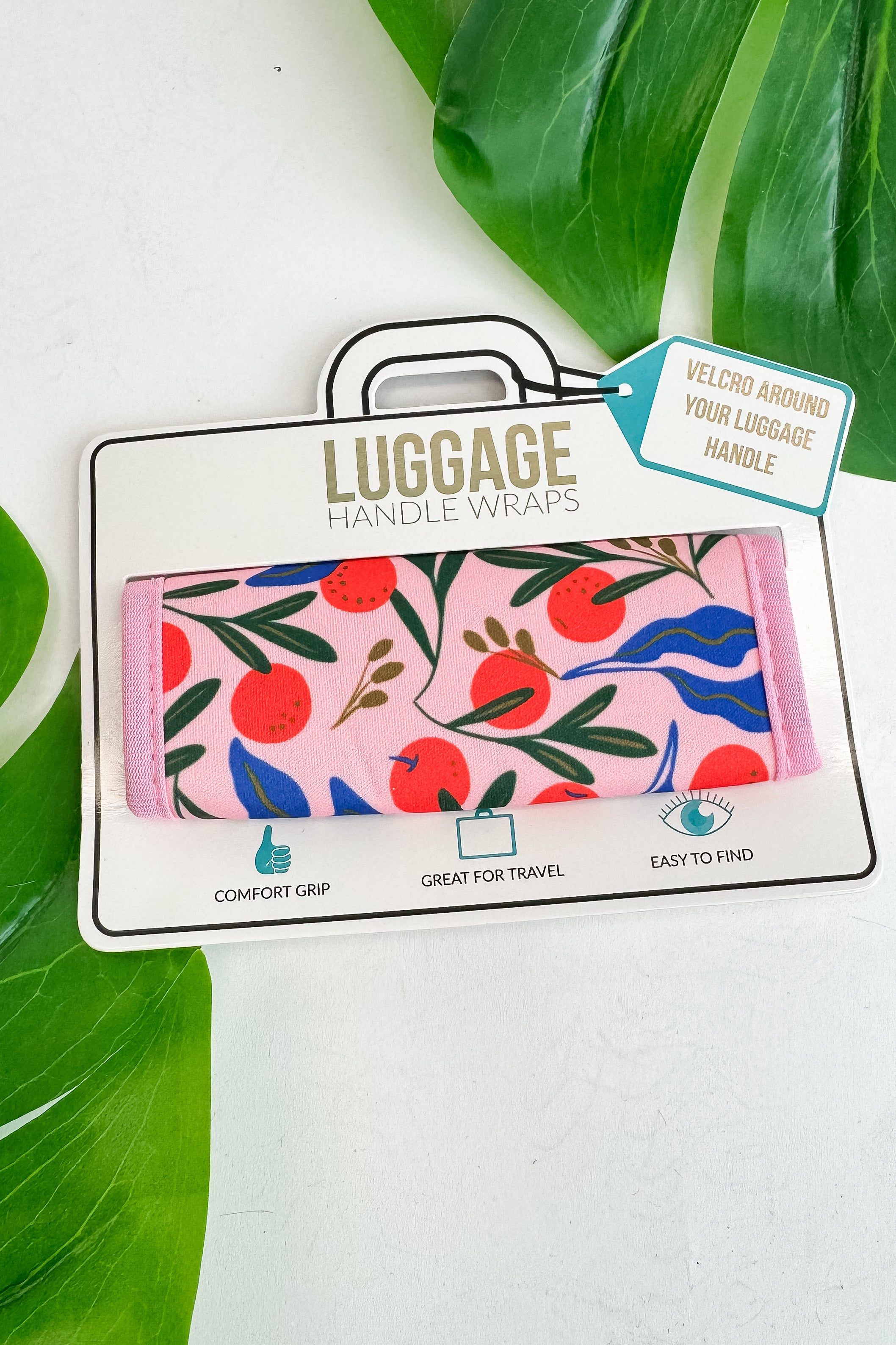 Luggage handle wrap with floral design on a white background