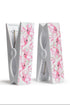 Two white clothespins with pink floral patterns on a white background
