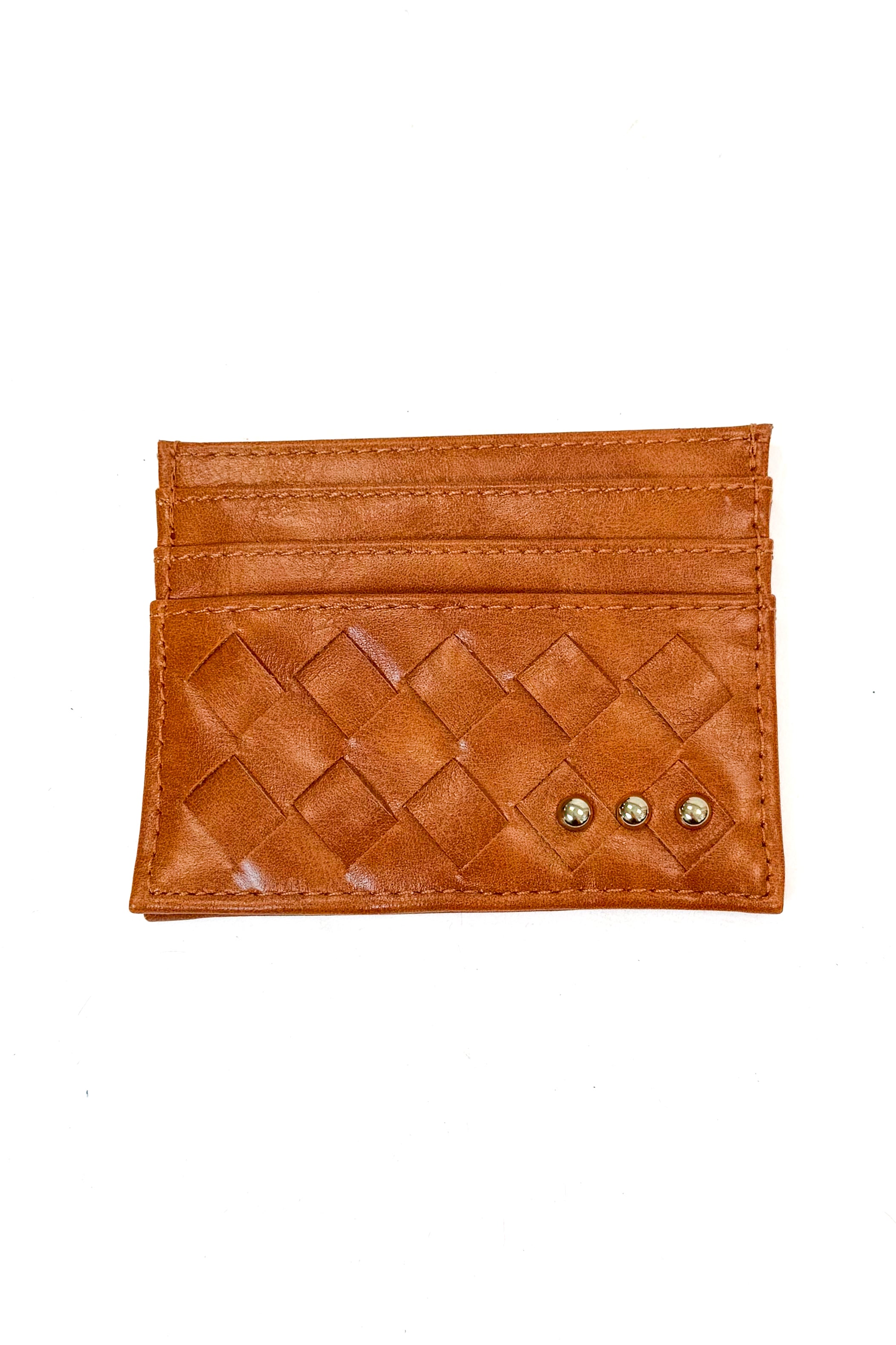 A small tan leather card holder wallet with a woven diamond pattern on the front, three card slots, and two small gold-tone studs on the right side, shown on a plain white background.