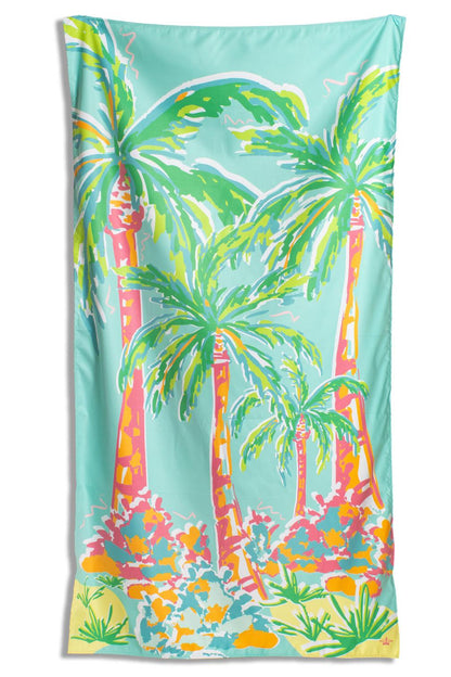 Colorful beach towel with palm tree design on a white background