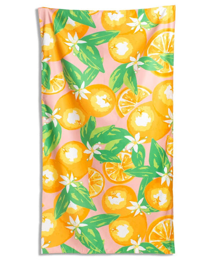 Towel with orange and lemon design on a pink background