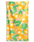 Towel with orange and lemon design on a pink background