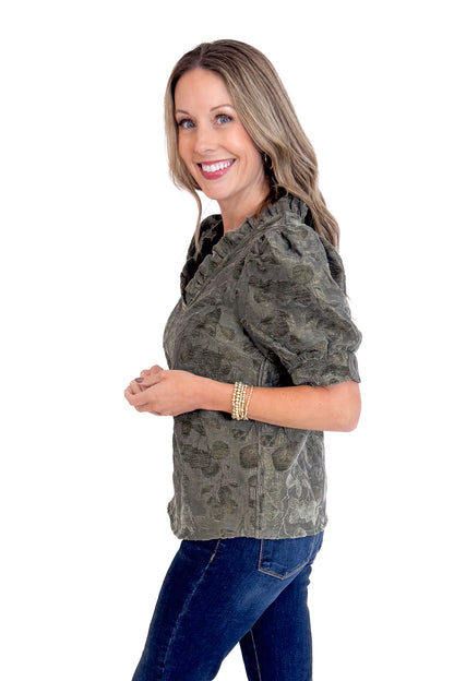 Woman wearing a blouse on a white background