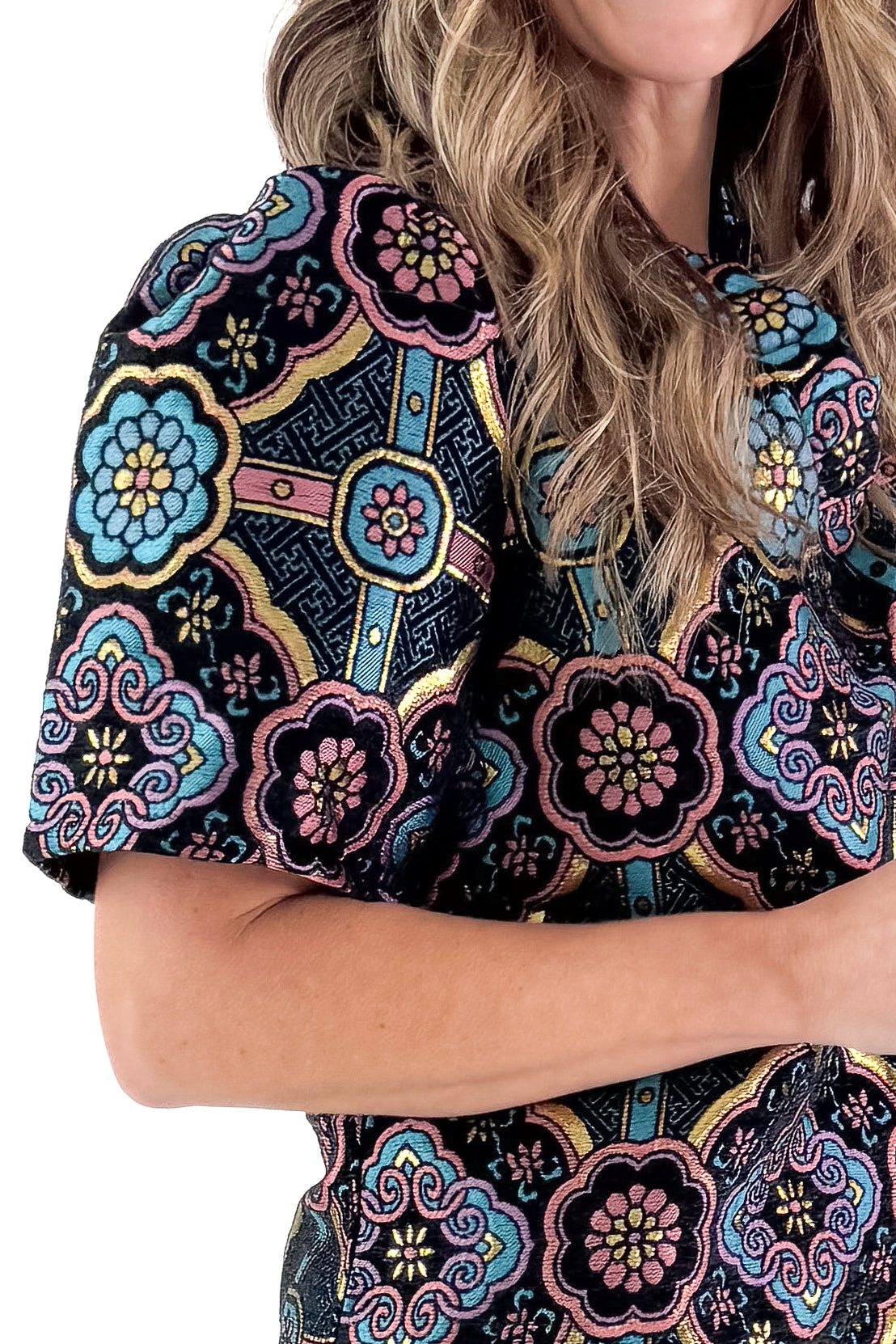 Sleeve detailed view of model wearing Black &amp; Multi Printed Jacquard Dress against white studio background.