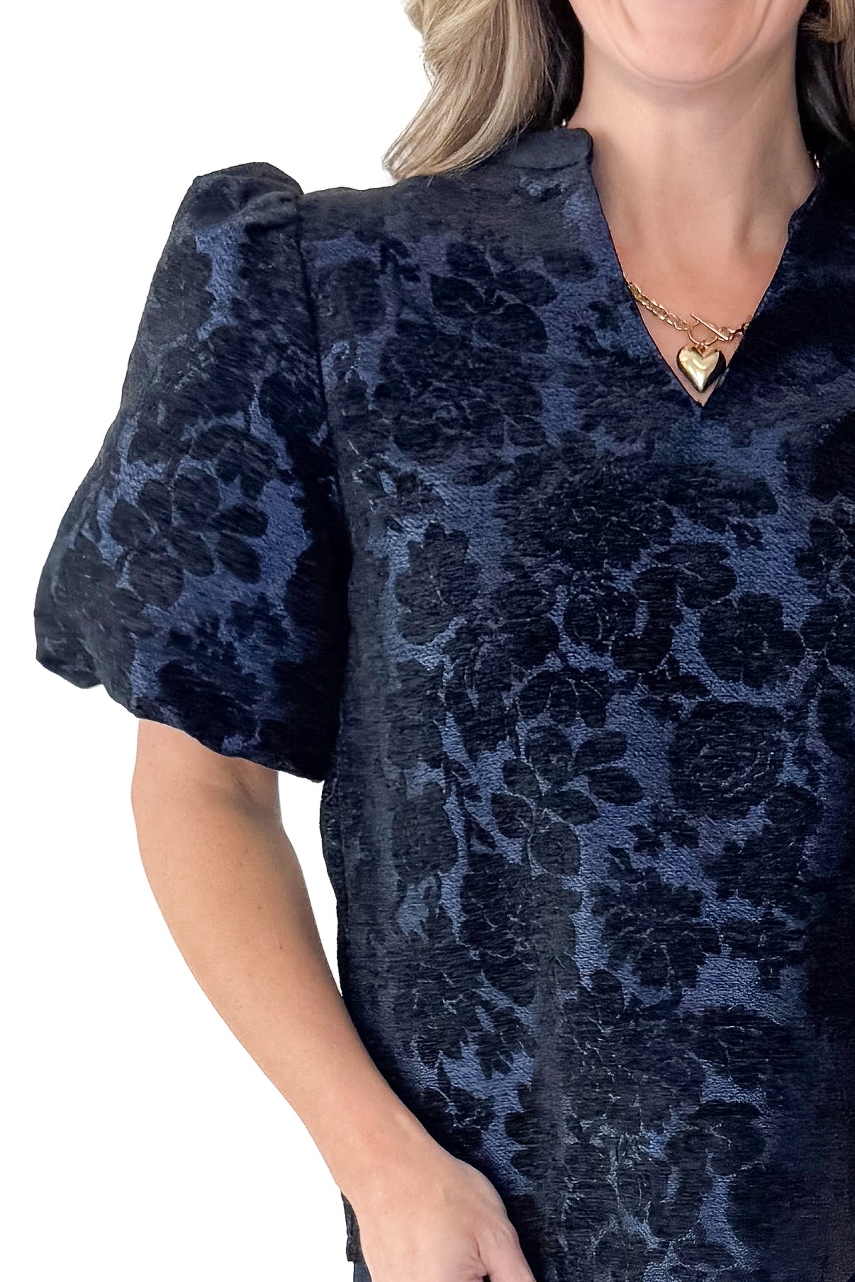 Front detail view of woman wearing Navy Floral Velvet Jacquard Top with jeans against white studio background.