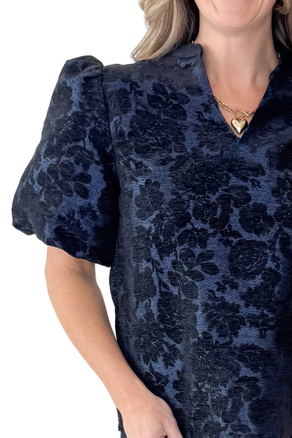 Front detail view of woman wearing Navy Floral Velvet Jacquard Top with jeans against white studio background.