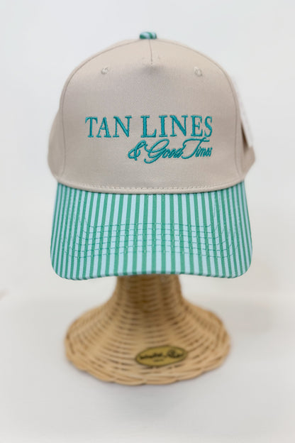 Beige cap with teal text on a white background