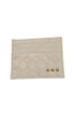 A light beige leather card holder with a diamond-quilted pattern and three small gold-tone studs, shown on a plain white background.