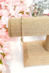 mixed metal enewton bracelet on a white surface with pink flowers and a disco ball in the background