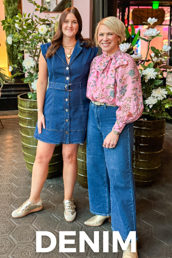 Two women standing together with 'Denim' text overlay, surrounded by plants.