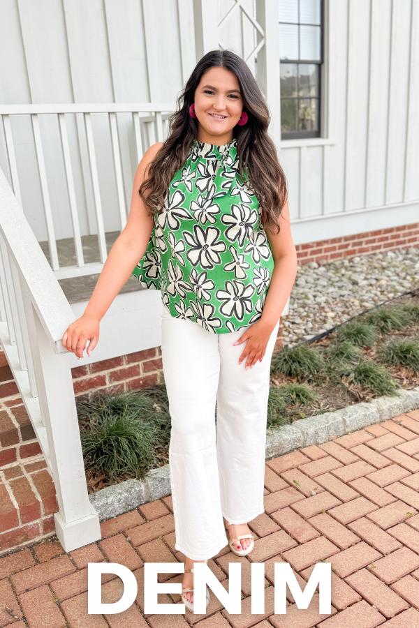 Woman wearing a green floral top and white pants on a porch with 'DENIM' text overlay.