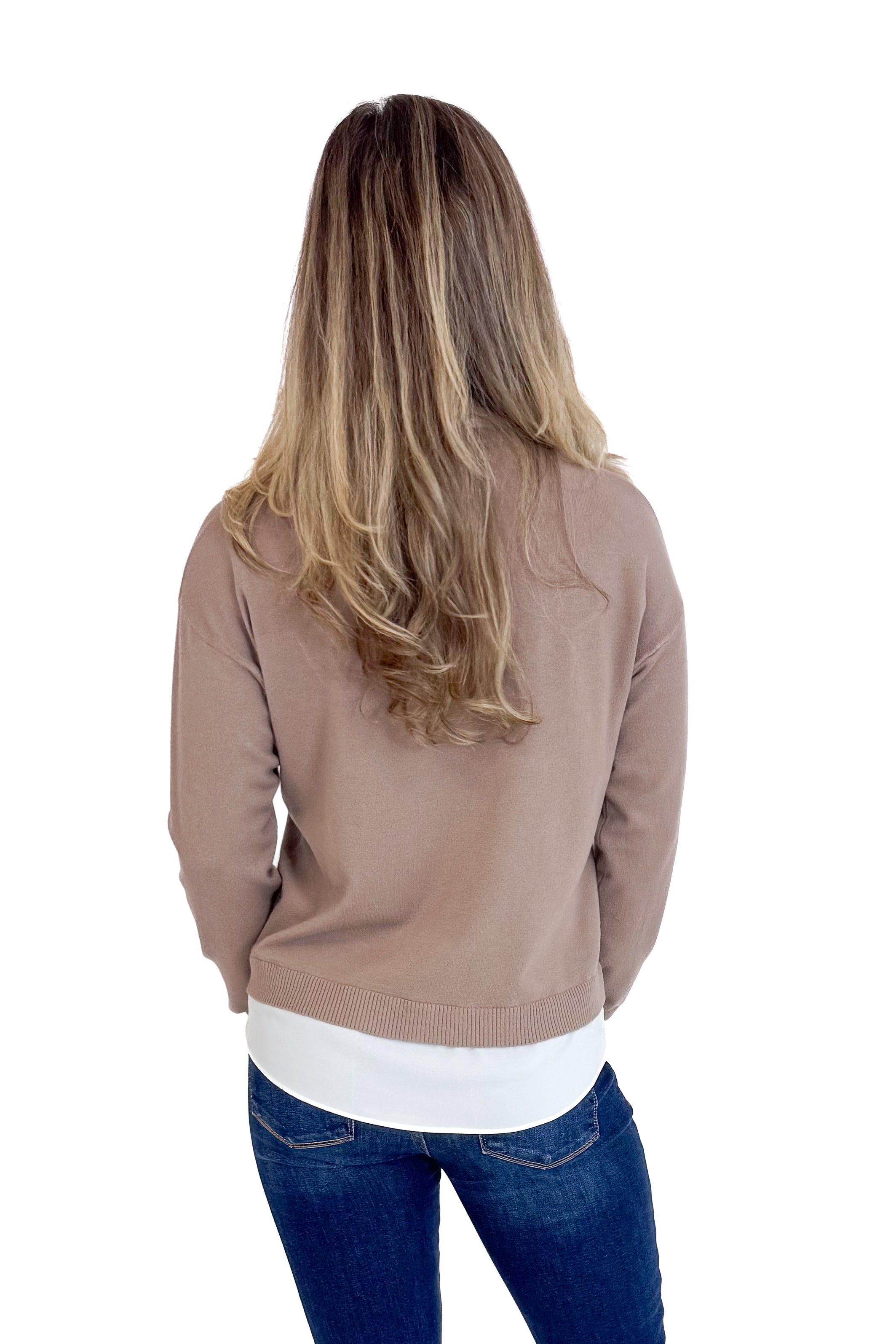 Person wearing a brown jacket, white shirt, and blue jeans on a white background