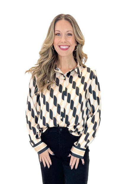 Front view of woman wearing Cream &amp; Black Abstract Print Button Up Top with jeans against white studio background.