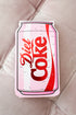 Diet Coke pocket notepad on a textured beige surface