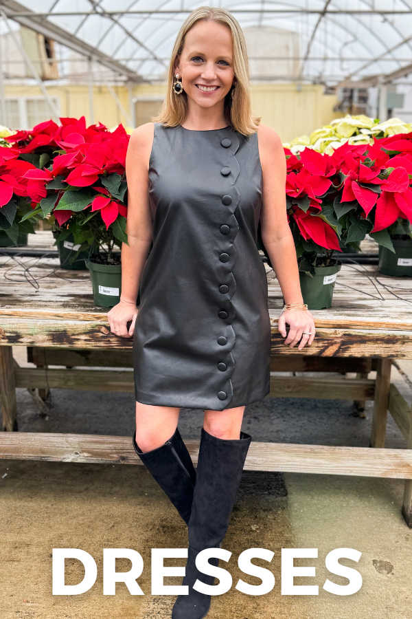Woman in a gray dress standing in front of potted plants with 'DRESSES' text overlay.