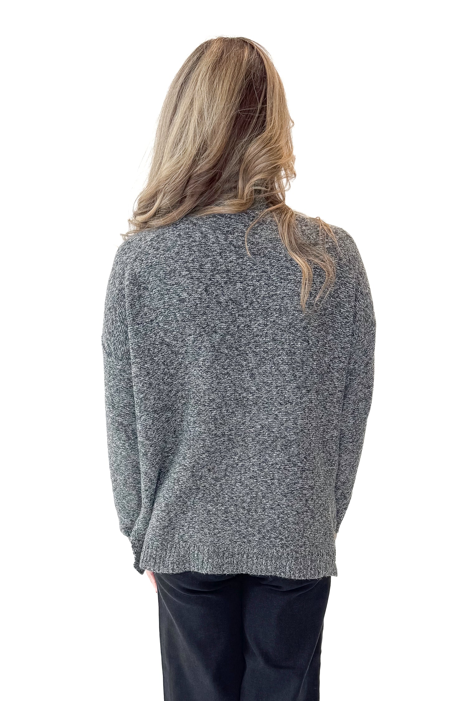 Back view of woman wearing Black &amp; Cream Marled Mock Neck Sweater with jeans against white studio background.