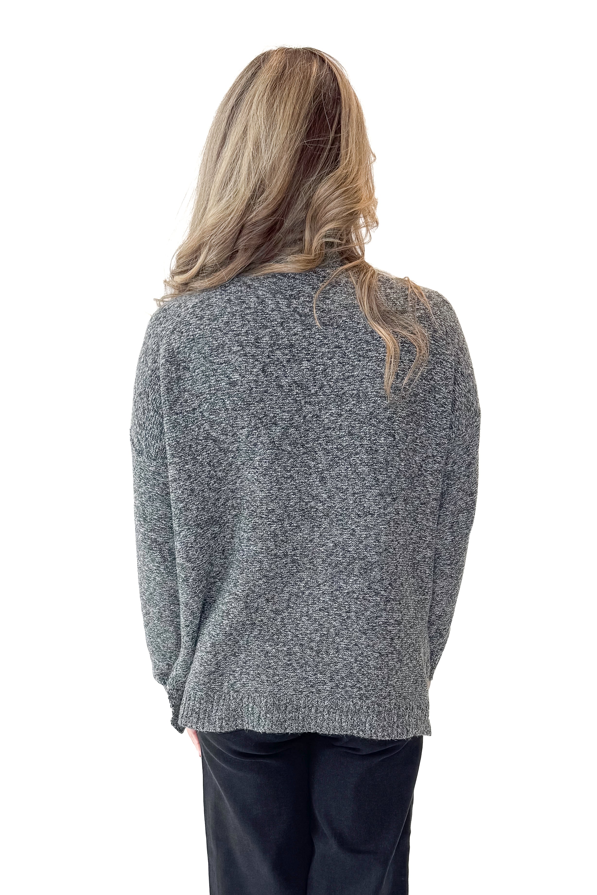 Back view of woman wearing Black &amp; Cream Marled Mock Neck Sweater with jeans against white studio background.