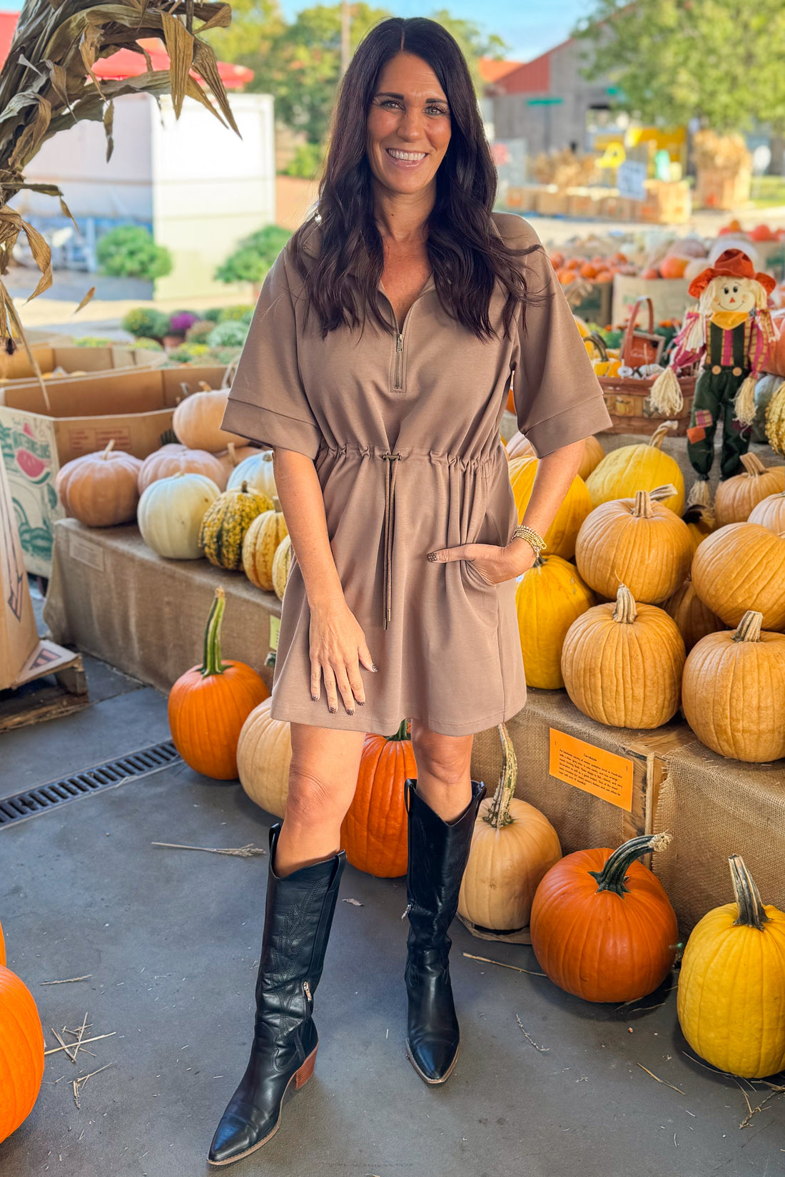 Woman wearing Fireside Glow Mocha 1/4 Zip Half Sleeve Dress by Entro - front view showing quarter zip neckline and half sleeves.