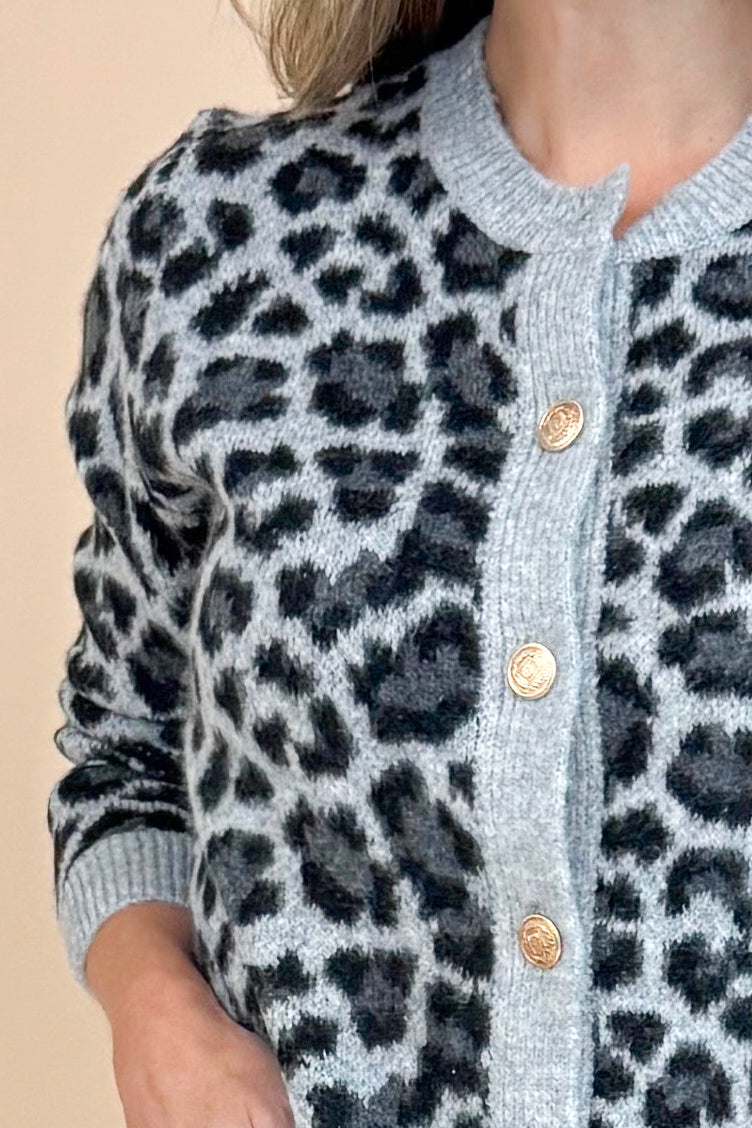 Detail front view of woman wearing Grey Leopard Button Up Cardigan.