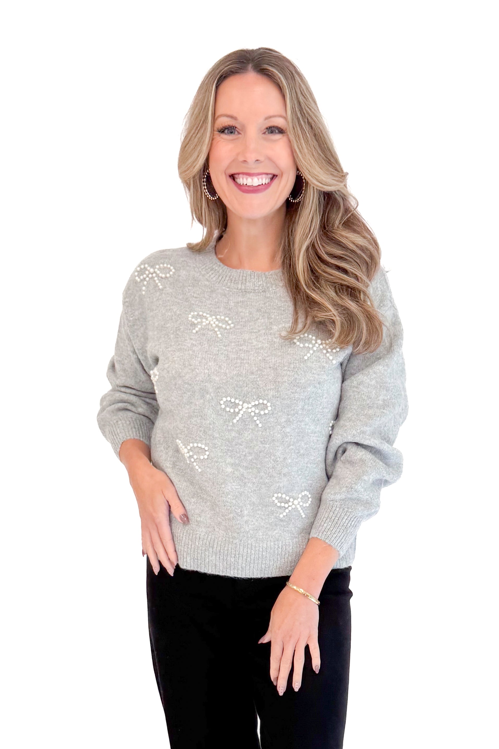 Front view of woman wearing Grey Pearl Bow Detail Sweater. 