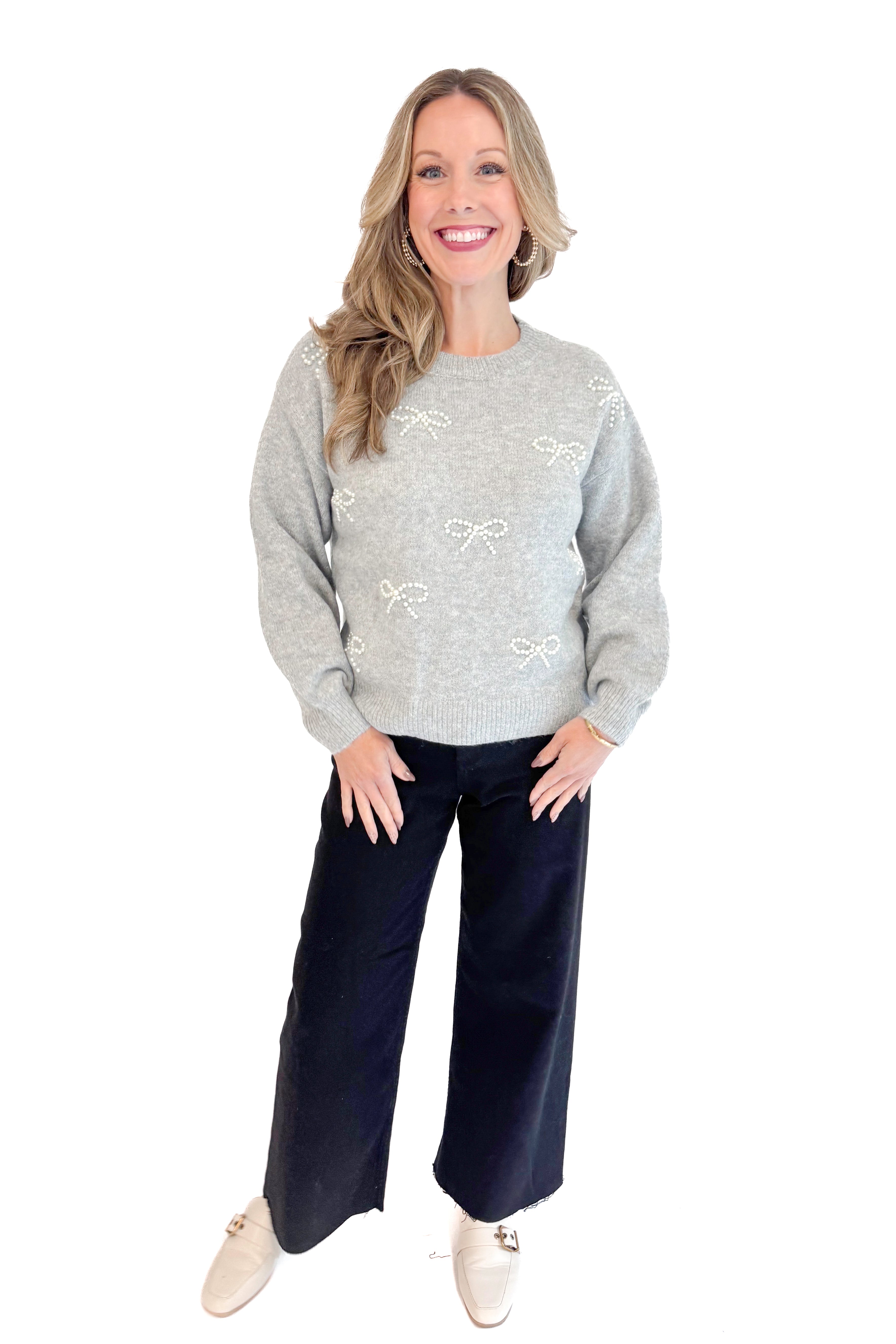 Front view of woman wearing Grey Pearl Bow Detail Sweater. 