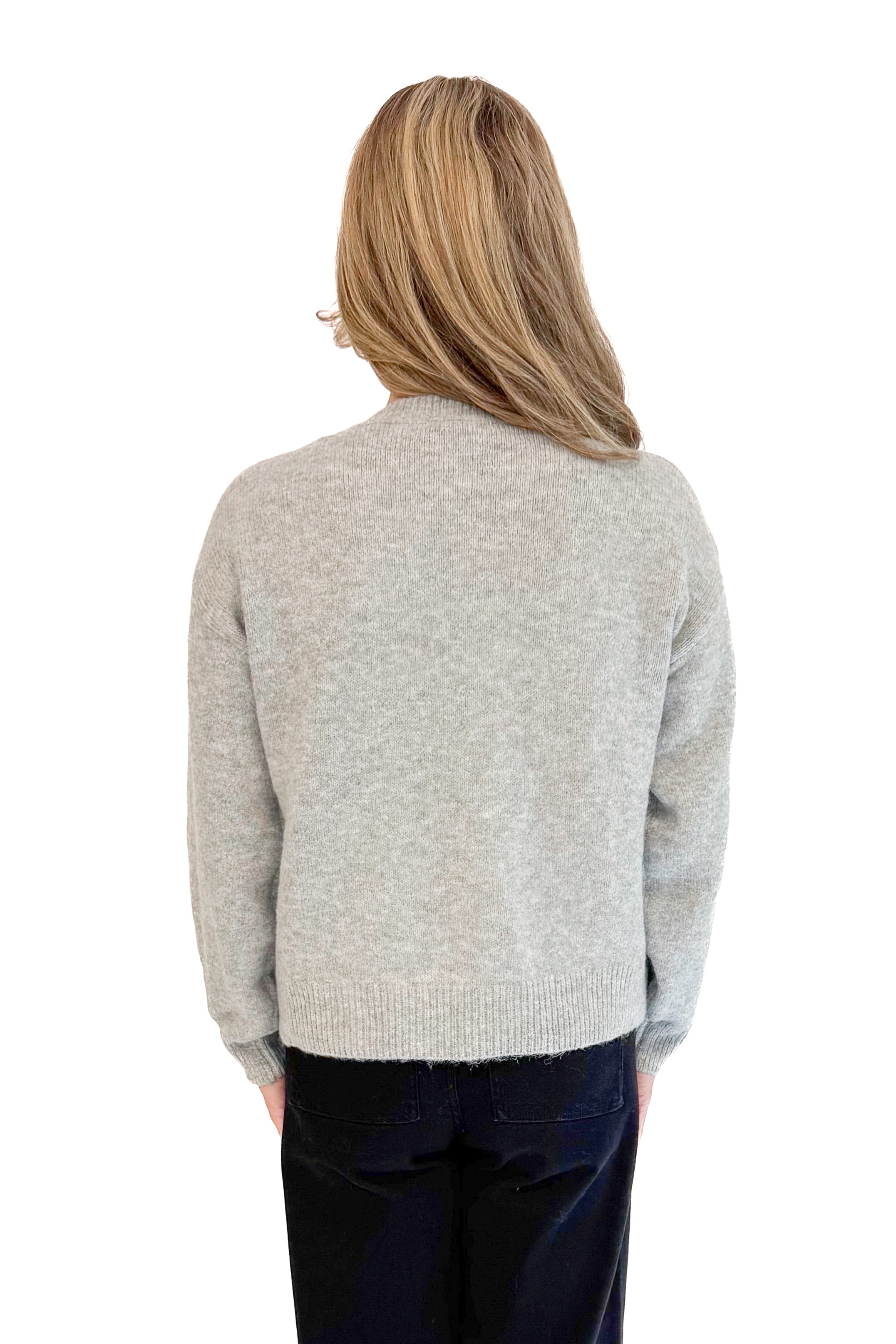 Back view of woman wearing Grey Pearl Bow Detail Sweater. 